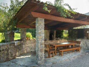 Outdoor dining - Apartment Krn 90 m2 in holiday house Maharac (part of socaholidays) with 3 bedrooms, top floor, airconditioning, sleep till 6, own balcony and terrace next to the shared garden and BBQ. (Tolmin)