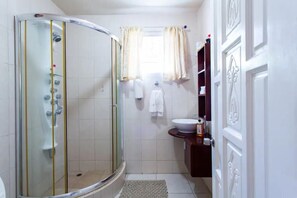Shower, hair dryer, towels, soap