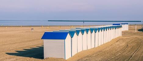 On the beach, sun-loungers, beach towels