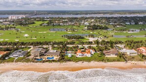 A coastal golf course with a beachfront, a marina, and residential buildings. - Penthouse/Oceanfront Building w/ Beach Access+ Heated Pool/Sunset & Rocket Views (Ormond Beach)