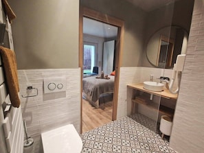 Shower, hair dryer, towels, soap