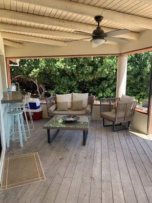 Outdoor dining - Cosy Canal front 3 bedroom villa with small private swimming pool and dock (Cooper Jack Bay Settlement)