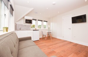 Split Level Deluxe Studio Apartment | Living area | Flat-screen TV, heated floors - Golders Green Serviced Apartments by Concept Apartments (London)