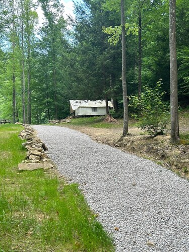 Glamping safari tent overlooking pond.  Kid and pet friendly.
