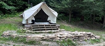 Glamping safari tent overlooking pond. Kid and pet friendly.