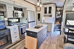 Coffee/tea maker, fridge, microwave, oven