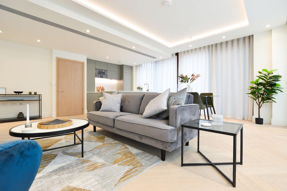 One Bedroom Apartment | Living area | Flat-screen TV, heated floors