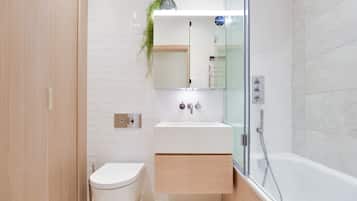One Bedroom Apartment | Bathroom | Rainfall showerhead, hair dryer, towels, soap