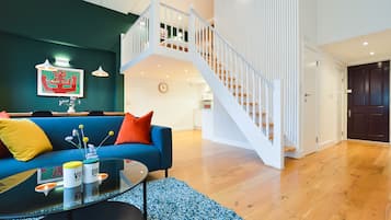Large Mezzanine Studio Apartment | Living area | Flat-screen TV