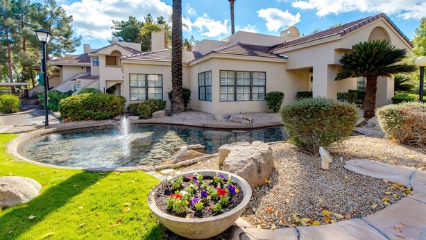 A residential building with a swimming pool, surrounded by well-maintained landscaping and palm trees. - Premier location in Scottsdale close to Old town & Open- HEATED pool & jacuzzi😎 (Paradise Valley)