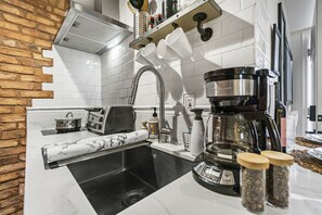 Fridge, microwave, stovetop, coffee/tea maker