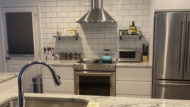 A modern kitchen with a stainless steel sink, a toaster, a kettle, and a built-in oven. - Little Farm: Private Country Setting, 15 minute drive to downtown Aiken (Aiken)