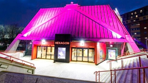 A building with a distinctive pink roof and the name "HEXAGON" on the entrance. - Period Apartment for 3, Near Uni & Hospital, Parking (Reading)