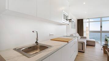 Fridge, microwave, stovetop, coffee/tea maker