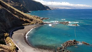 A coastal landscape with a curving road, rocky shoreline, and distant mountains. - Holiday Apartment 'Luxury Loft El Roque 1' with Sea View and Wi-Fi (Tacoronte)