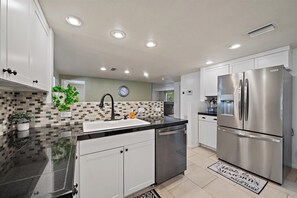 Fridge, microwave, oven, stovetop - Sunshine Haven | HUGE Backyard, Private heated Pool + Fire Pit! (Sarasota)