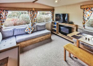 TV - Well presented 12ft-wide caravan with one double and two twin. (Perranporth)