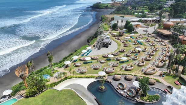 A resort with a beach view, circular seating areas, and a pool. - Oshom Bali at Nuanu Creative City (Tabanan)