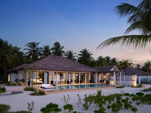 A resort with a pool, thatched-roof buildings, and palm trees. - Villa Haven Resort Maldives (Dhiffushi)