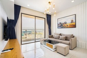 Luxury Apartment, 2 Bedrooms, Balcony, City View | Living area | 49-inch flat-screen TV with digital channels, Netflix - Helios Riverside Apartment (Ho Chi Minh City)