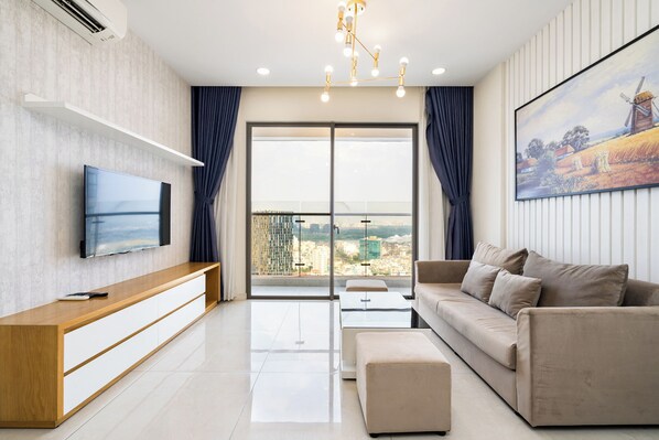 Luxury Apartment, 2 Bedrooms, Balcony, City View | Living area | 49-inch flat-screen TV with digital channels, Netflix - Helios Riverside Apartment (Ho Chi Minh City)