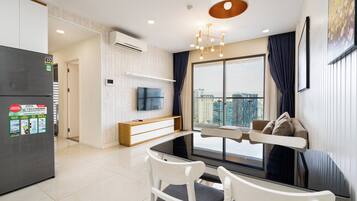 Luxury Apartment, 2 Bedrooms, Balcony, City View | Living area | 49-inch flat-screen TV with digital channels, Netflix