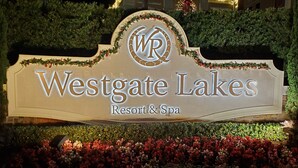 A sign for Westgate Lakes Resort & Spa, featuring a prominent logo and the resort name.