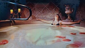 A room with a large mirror, a table with a vase, and a patterned floor. - DISNEY/UNIVERS Area 2BDR WestgateRsrt~Avail Wk 4/4-4/11~ Watrprk/LzyRv (Orlando)