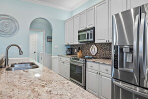 Coffee/tea maker, fridge, microwave, oven