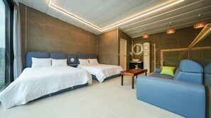 A modern hotel room with two beds, a sofa, and a small table. - Metaverse Pension (Gapyeong)