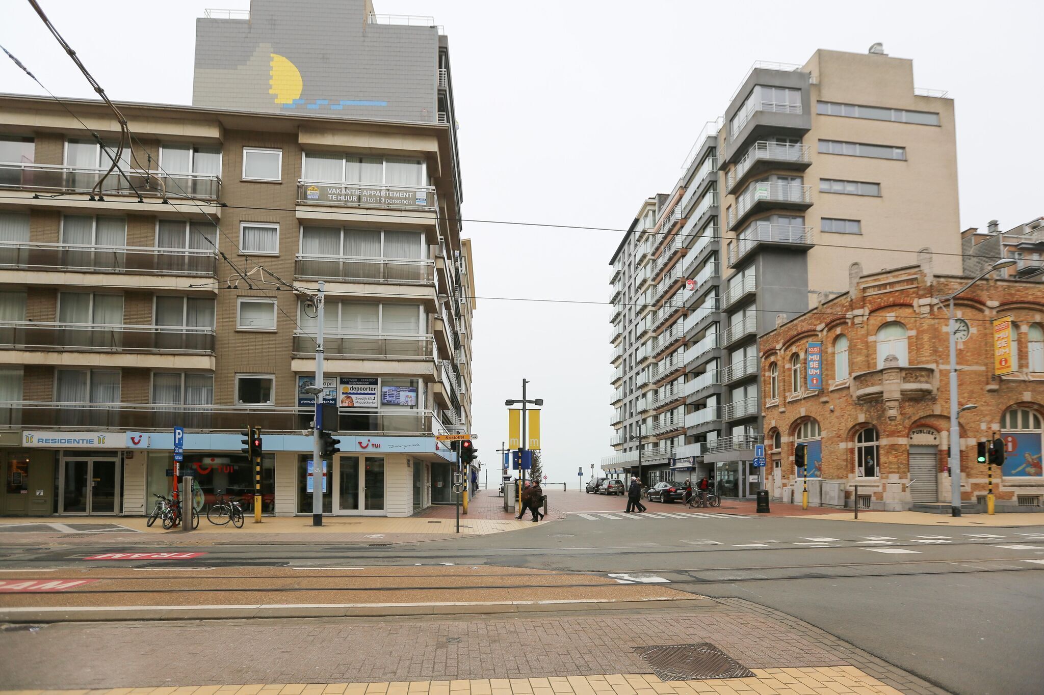 A multi-story building with a sign indicating it is a hotel.