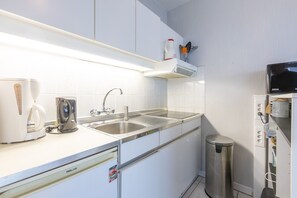 Fridge, microwave, stovetop, coffee/tea maker