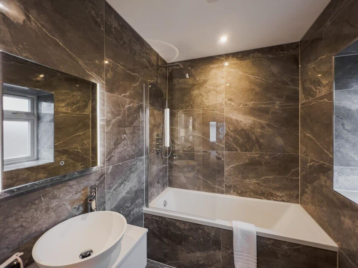 Shower, hair dryer, towels, shampoo