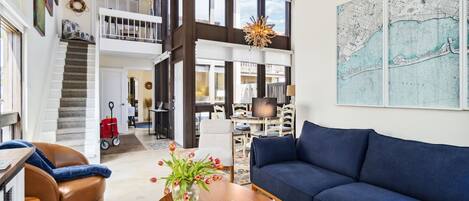 Soaring two-story living room with vaulted ceilings