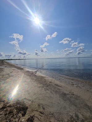 On the beach, sun loungers