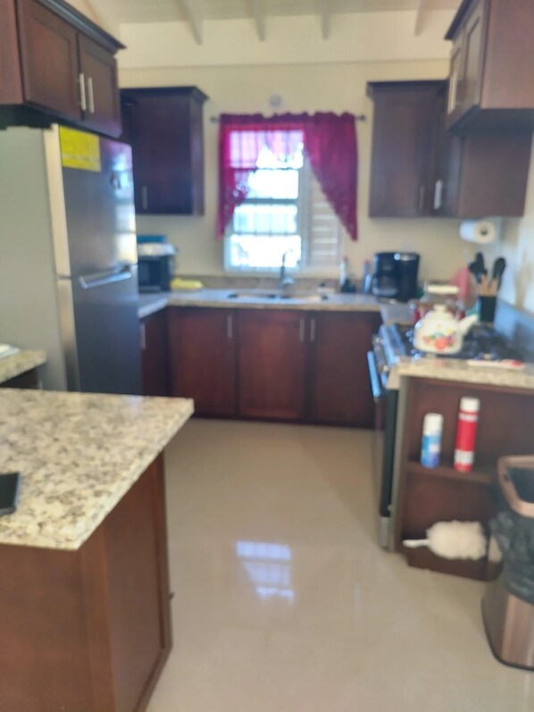 House | Private kitchen | Fridge, microwave, oven, stovetop - Remarkable 2-bed House in Old Harbour (Old Harbour)