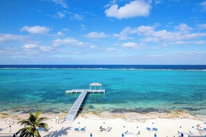 On the beach, sun loungers, beach towels - Rum Point Resort 406: Stay Longer for Less! (Seven Mile Beach)