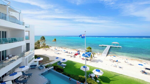 A resort with a pool, beach, and ocean view. - Rum Point Resort #305 by Grand Cayman Villas (Seven Mile Beach)