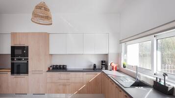 Luxury Villa | Private kitchen | Full-size fridge, microwave, oven, stovetop