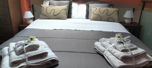 1 habitación, tabla de planchar con plancha, cuna de viaje y wifi