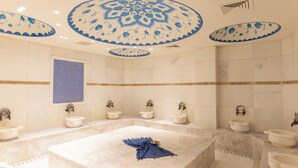 A bathroom with a large marble bathtub, multiple sinks, and decorative ceiling medallions. - Zemi Hotel Cappadocia (Nevsehir)