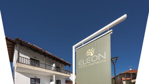 A building with a balcony and a sign that reads "ECLON SUITES & APARTMENTS". - Eleon Suites & Apartments (Kassandra)