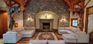 Interior - Vaulted beam ceilings, a huge rock fireplace, stream nearby, large campfire area (Provo)