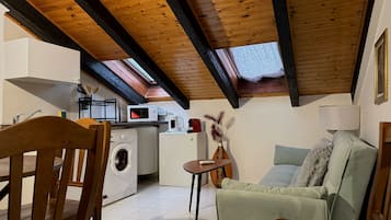 Basic Apartment | Living area | 40-inch flat-screen TV with digital channels