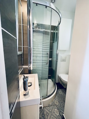 Shower, hair dryer, towels, soap