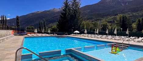 Seasonal outdoor pool, open 11:00 AM to 7:00 PM, pool loungers