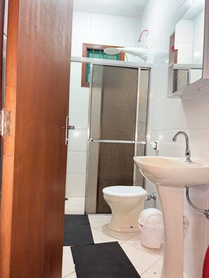 Shower, hair dryer, soap, toilet paper