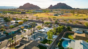 A residential area with houses, a swimming pool, and a baseball field. - HOLLY HOUSE! Heated Pool - 6mins to Old Town - Resort Backyard (Scottsdale)