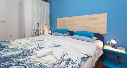 Holiday flat with air conditioning, WiFi, car park, washing machine