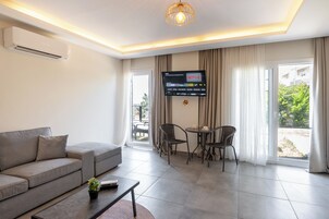 Basic Apartment, 2 Double Beds, Kitchen, Garden View | Living area | 42-inch Smart TV with digital channels